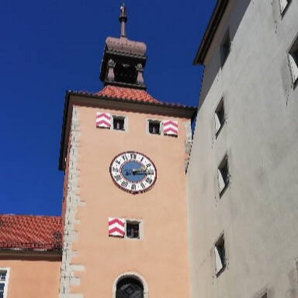 Clock tower with a clock face and a spire.
